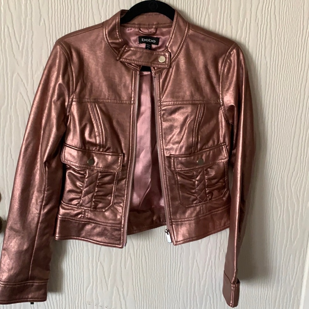 Pink metallic jacket. Wear and tear. It’s been in the closet for over 15 year.